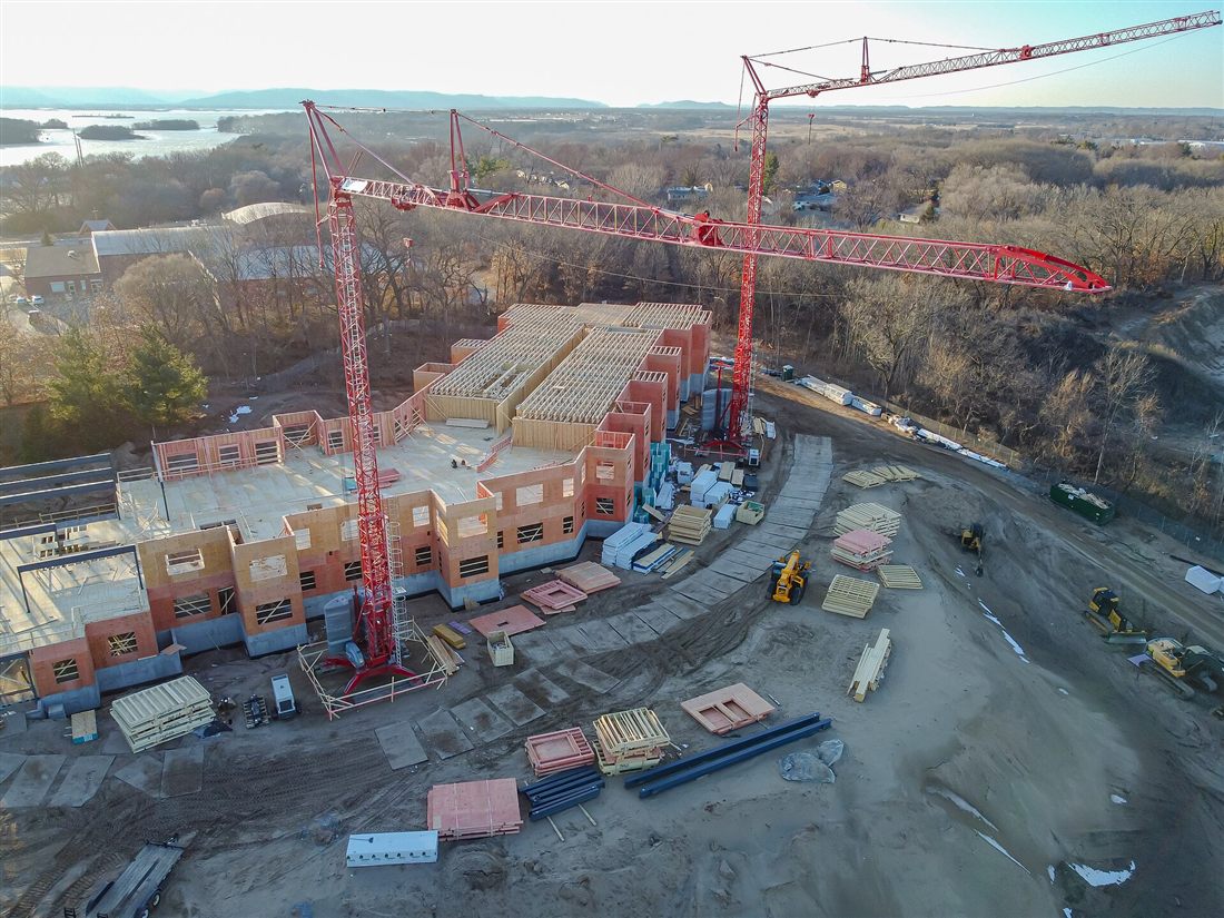 A construction site with tower cranes, seen from above
