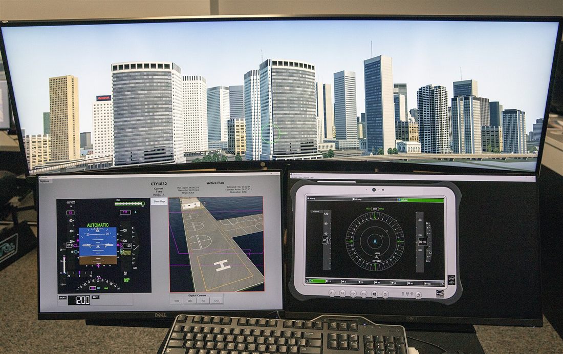 Multiple monitors displaying live tracking and monitoring dashboards